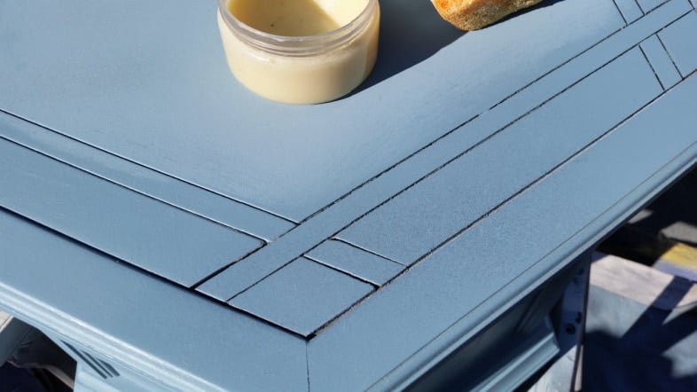 heirloom tradtions clear wax on blue table top