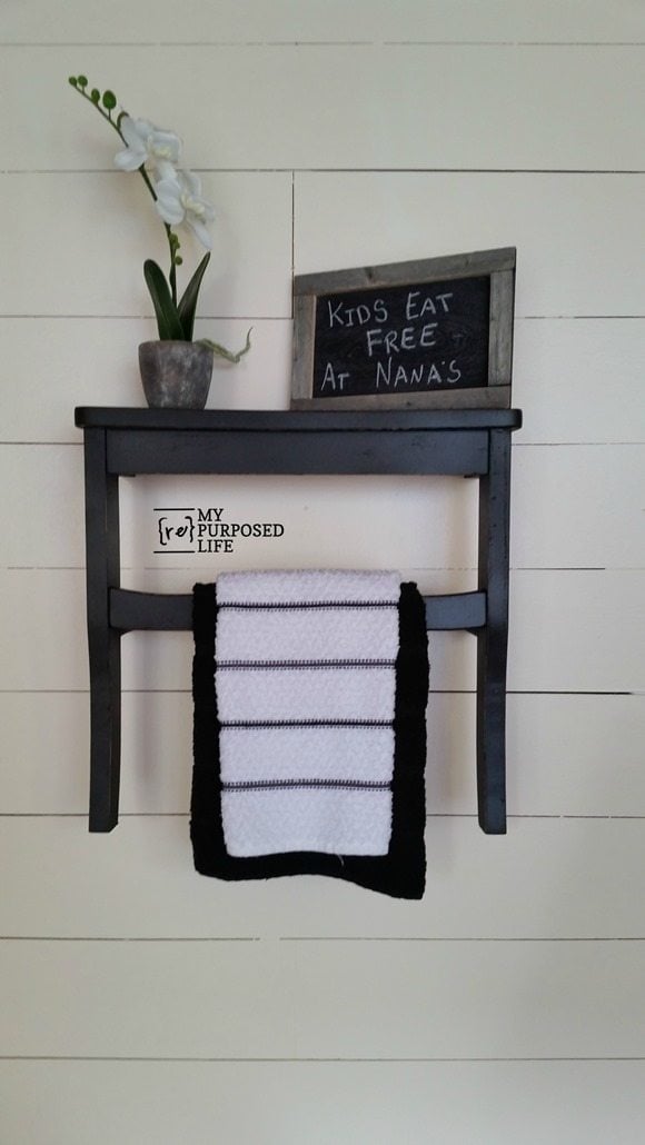black kitchen towel rack shelf using repurposed chair seat MyRepurposedLife.com