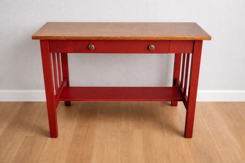 antique library table with red paint