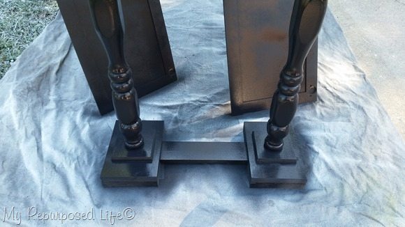 black primer on double pedestal table