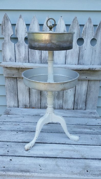 metal tiered stand with vintage cake pans