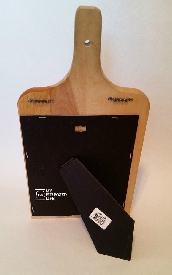 picture frame easel to make chalkboard cookbook kitchen stand out of a cutting board MyRepurposedLife.com
