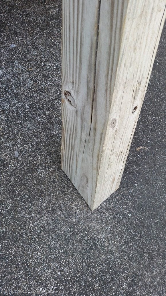 rustic display ladder rests at an angle on the ground