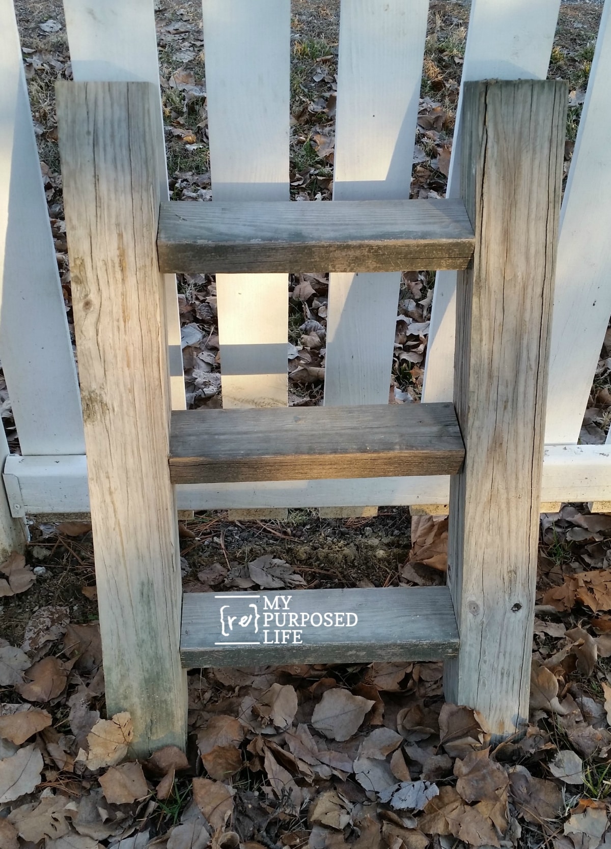 rustic ladder reclaimed wood plant display for outdoors MyRepurposedLife.com