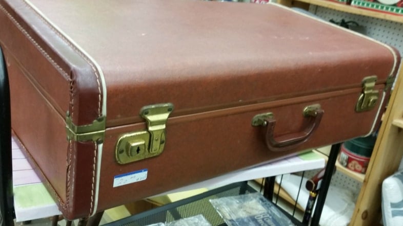 thrift store brown vintage suitcase