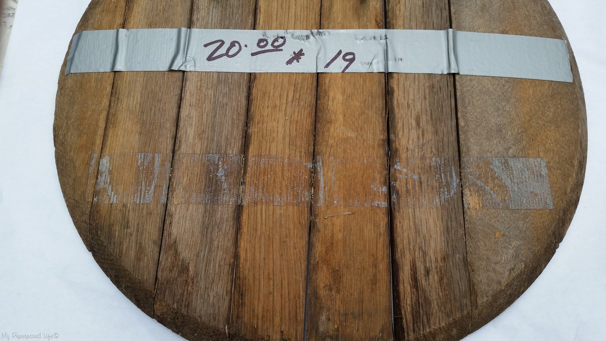 whiskey barrel lid taped