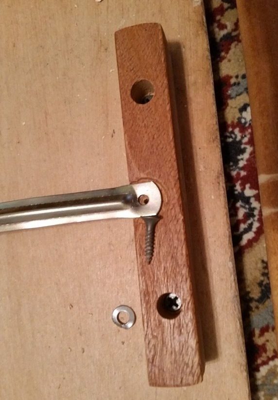 dislodge dowel by removing screw
