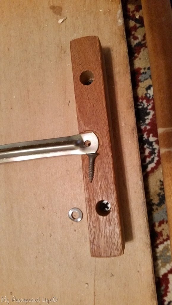 dislodge dowel by removing screw