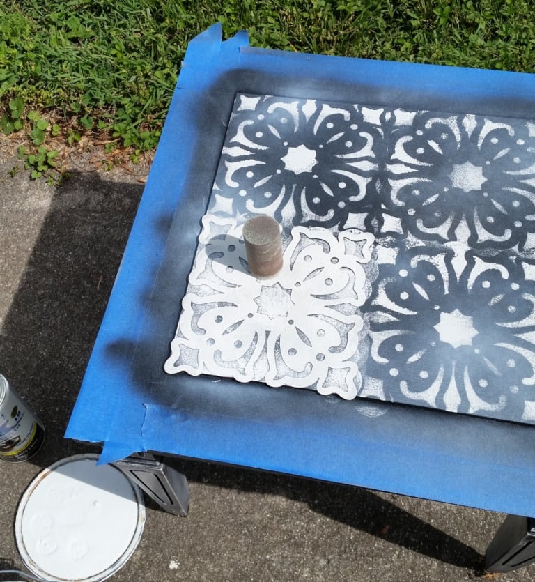 stenciling a table top with a foam pouncer