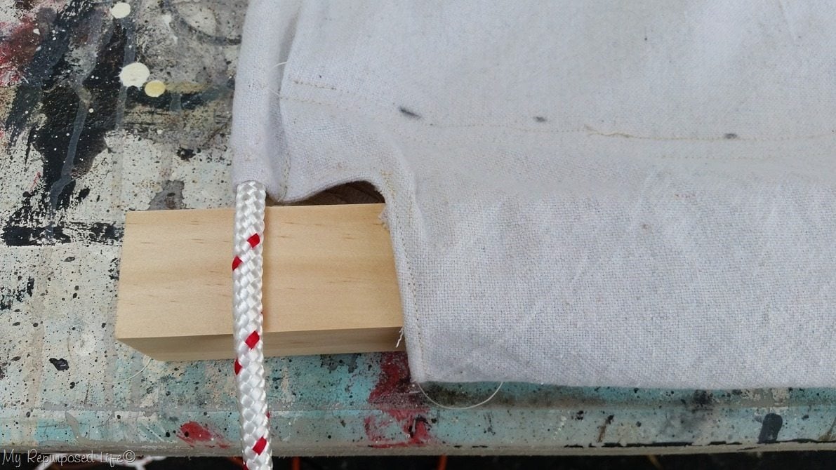 insert 2x2 into hem of diy drop cloth hammock