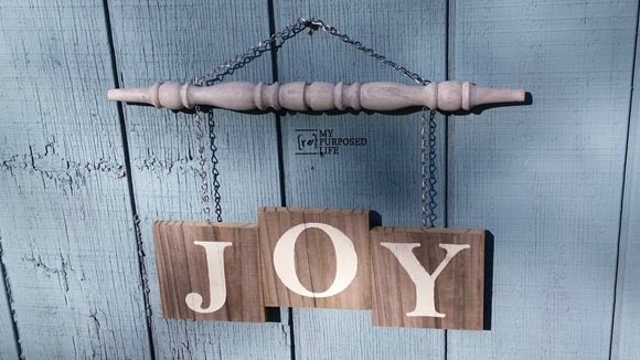 Joy spindle sign hanging on shed