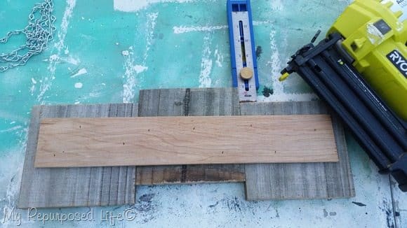 brad nailer attaches plywood