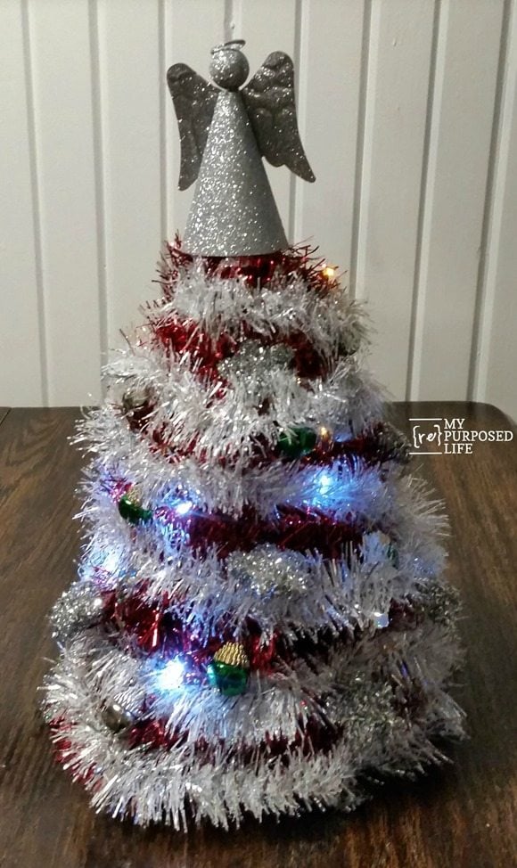 garland Christmas tree using dollar store items including a birthday hat MyRepurposedLife.com Dollar Store Design Squad