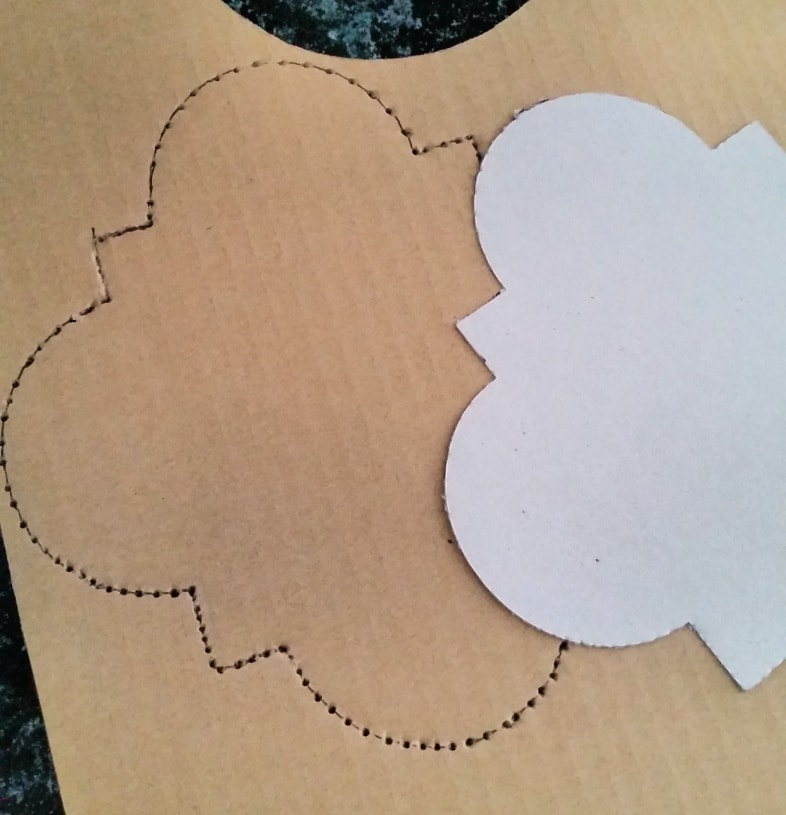 make a heavy cardboard pattern for stenciling