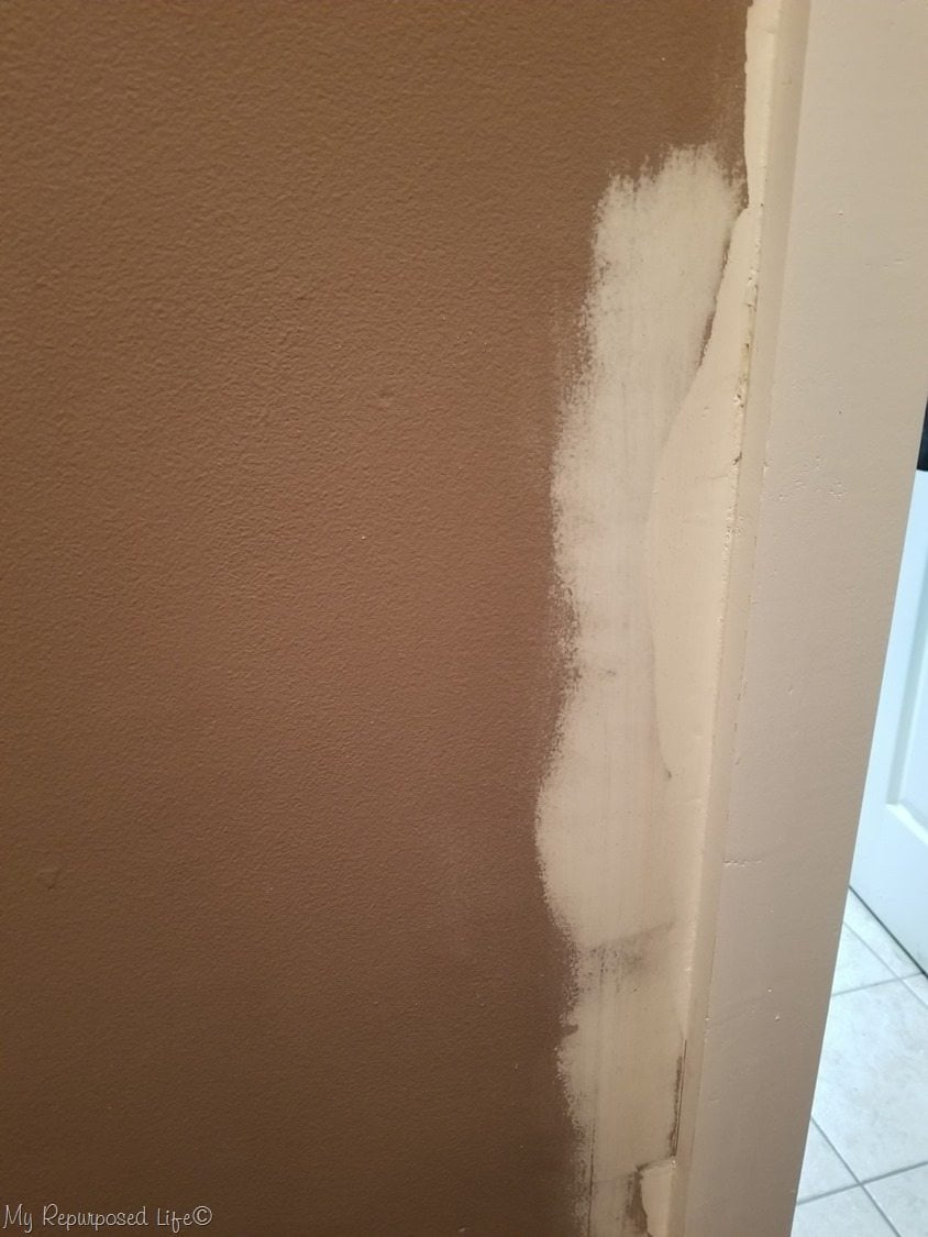 patching broken plaster around door trim
