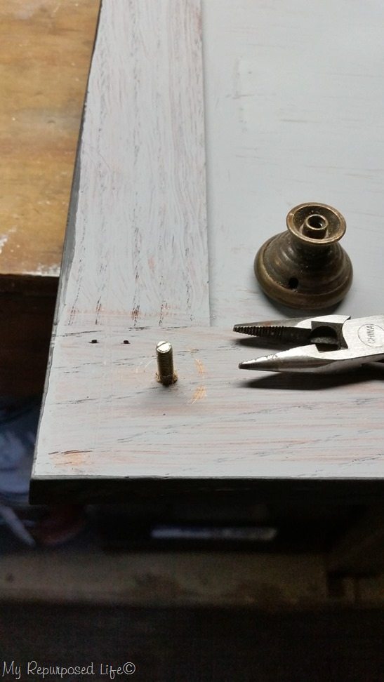 thread screw into cabinet door - attach knob