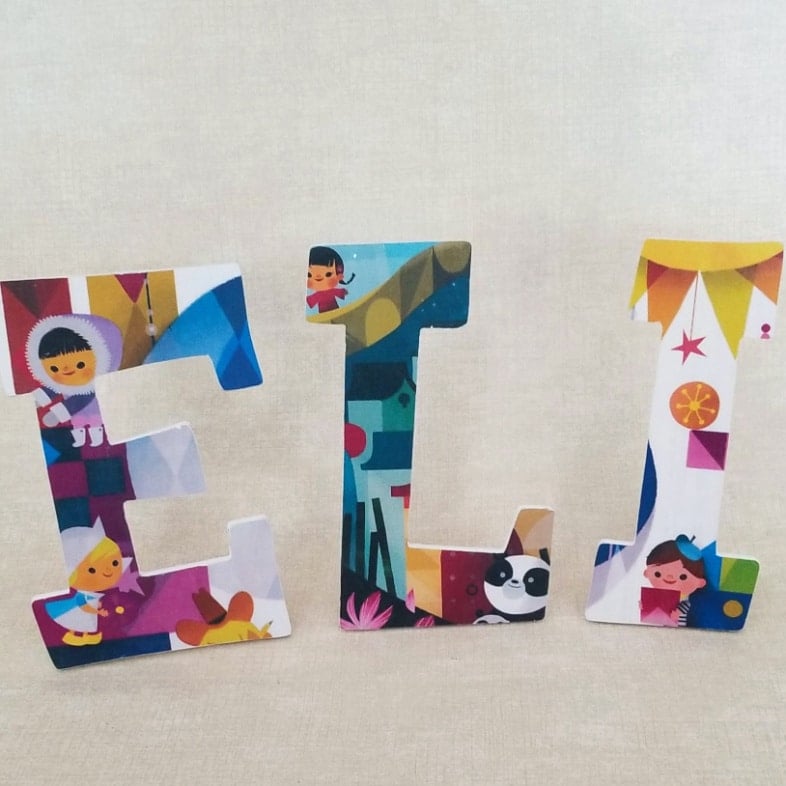 ELI wooden decoupage letters with it's a small world pictures