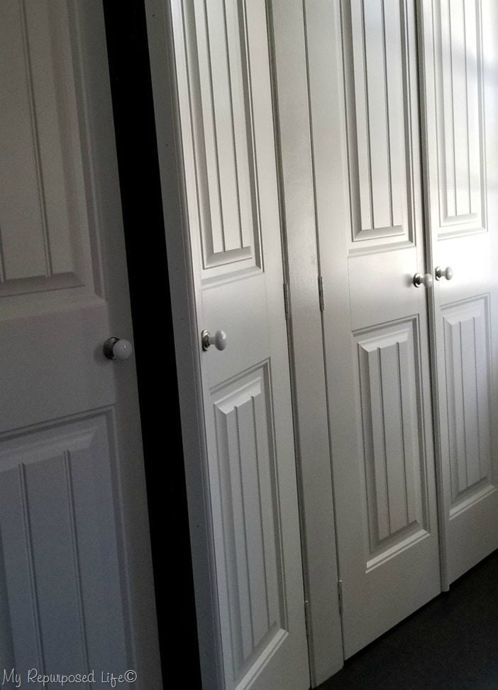 t molding and door knobs on wall to wall closet french doors