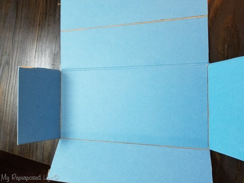 carefully fold up each side of the game board box