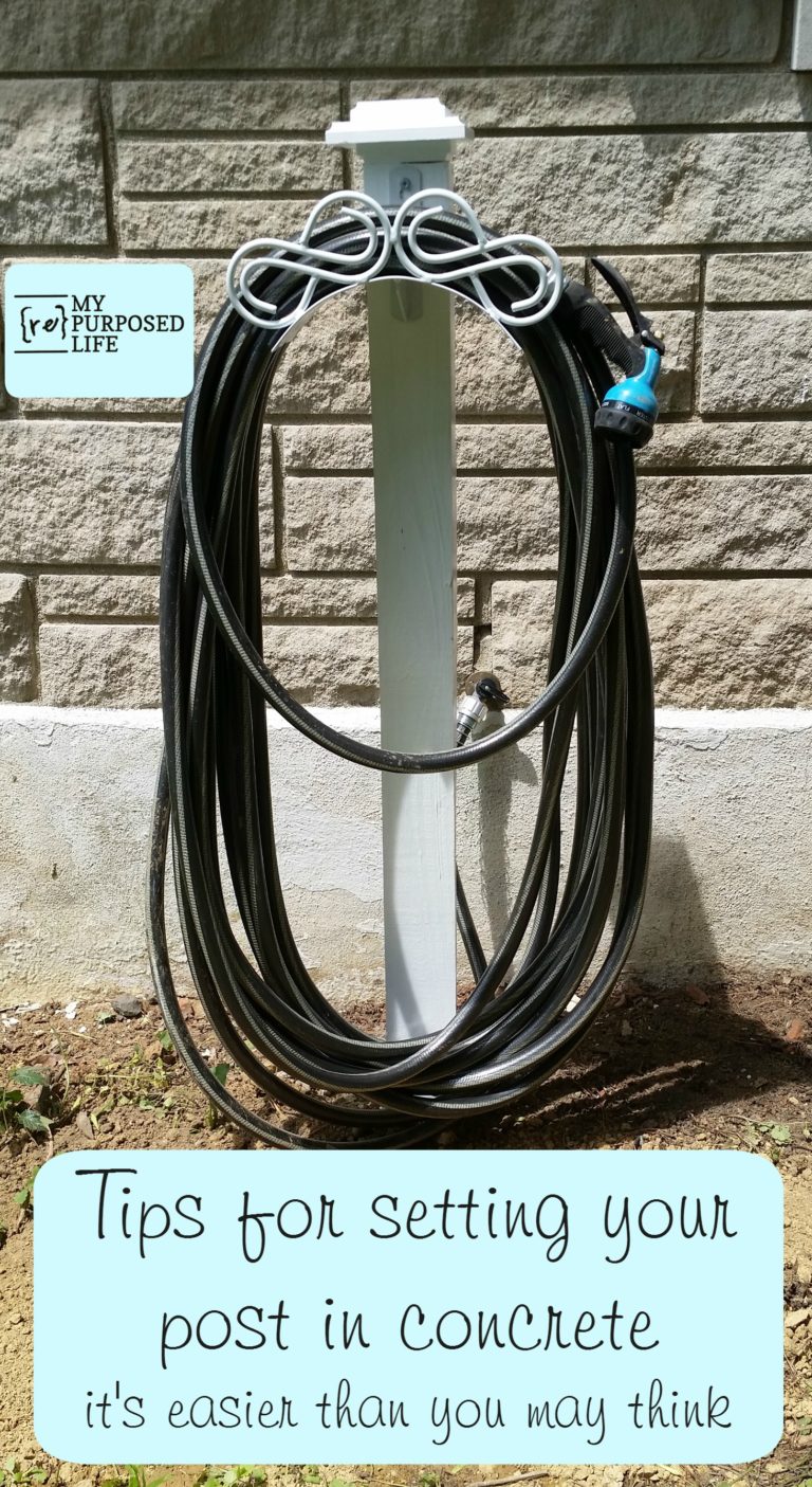 white post with a hose reel