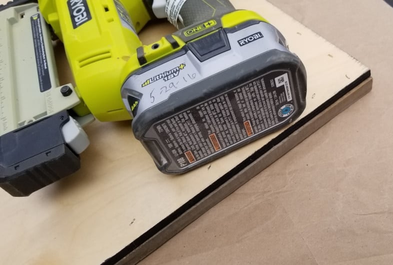 a staple gun resting on an upside down DIY frame