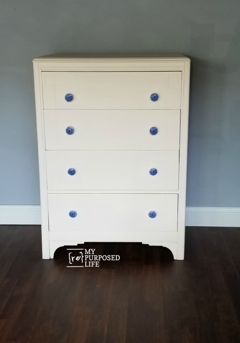 antique white dresser with decoupaged blue knobs MyRepurposedLife.com