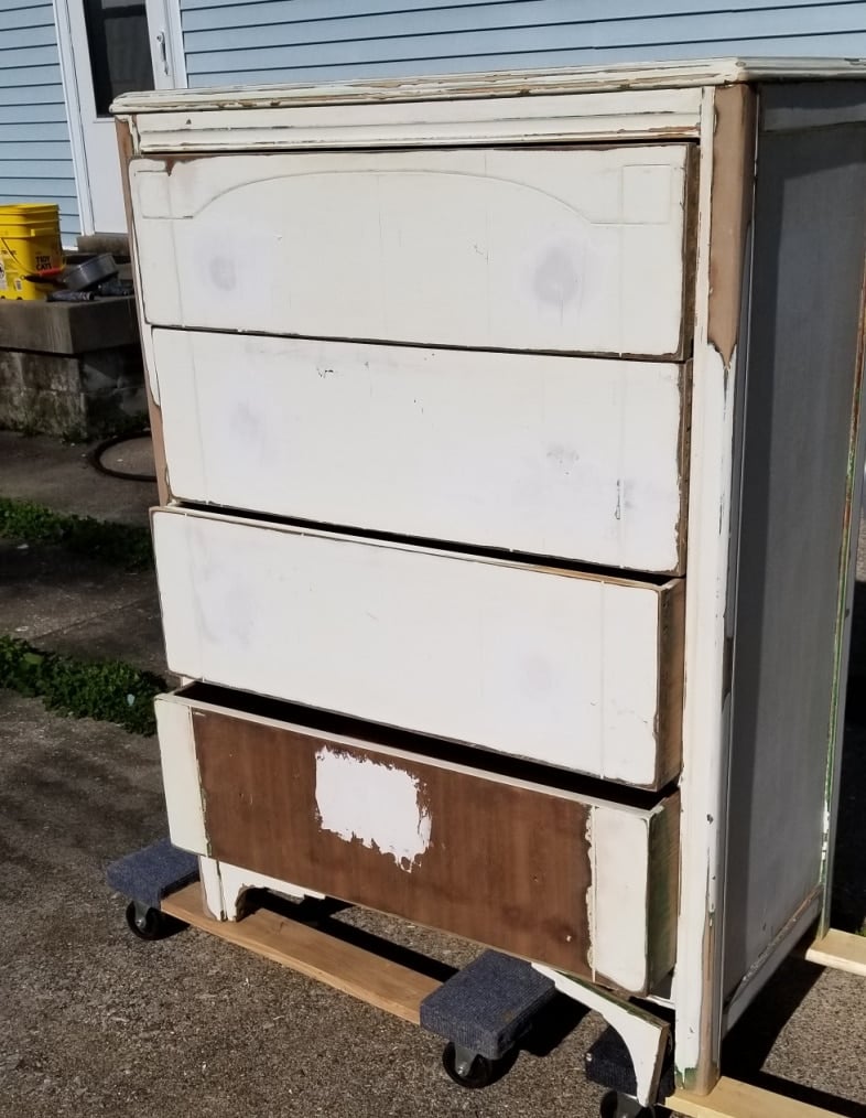 beat up white chest of drawers after sanding