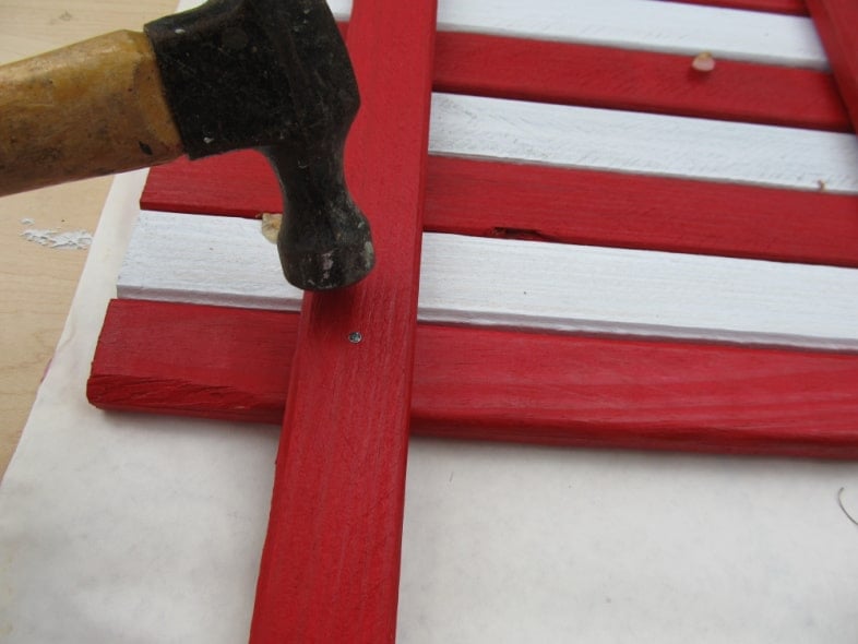 hammer tapping nails in place