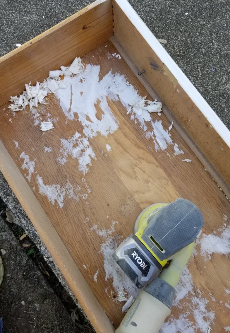 removing contact paper from inside drawer with a sander
