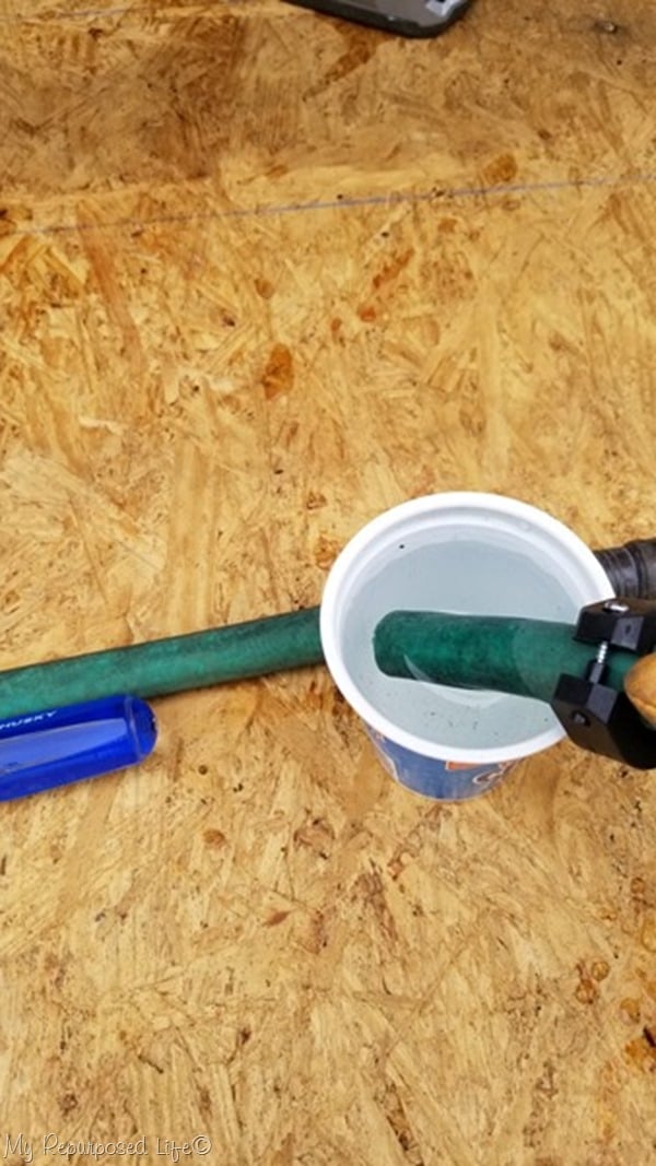 soak hose end in cup of warm water