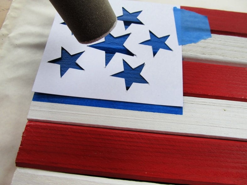 stencil the stars with a foam pouncer and white paint