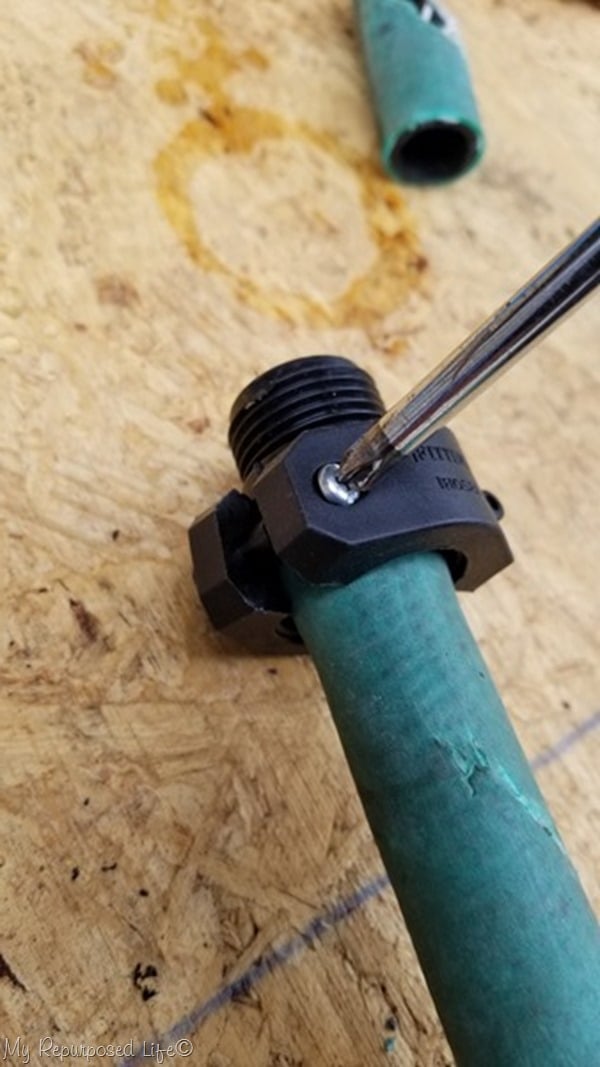 tighten screws on sleeve to make hose repair