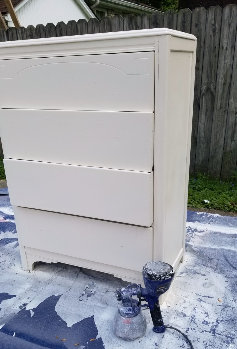 white dresser painted with a paint sprayer