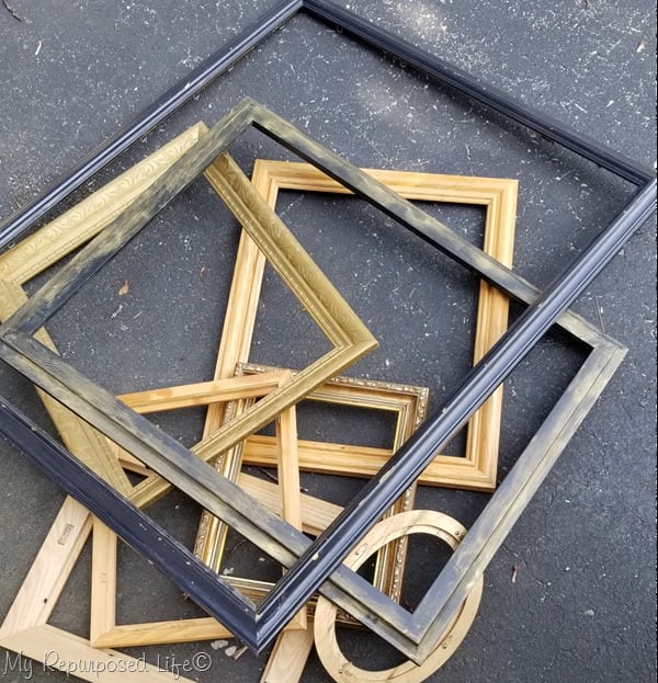 pile of thrift store picture frames