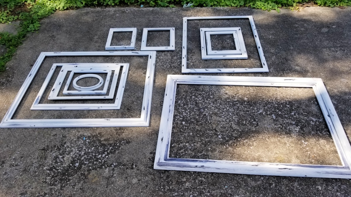 randome white chippy frames laying on a driveway
