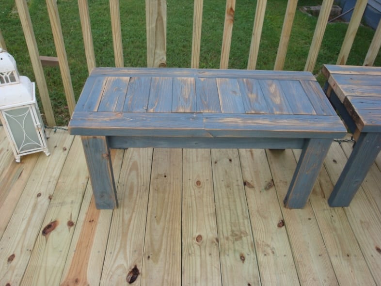blue 2x4 bench sitting on new deck