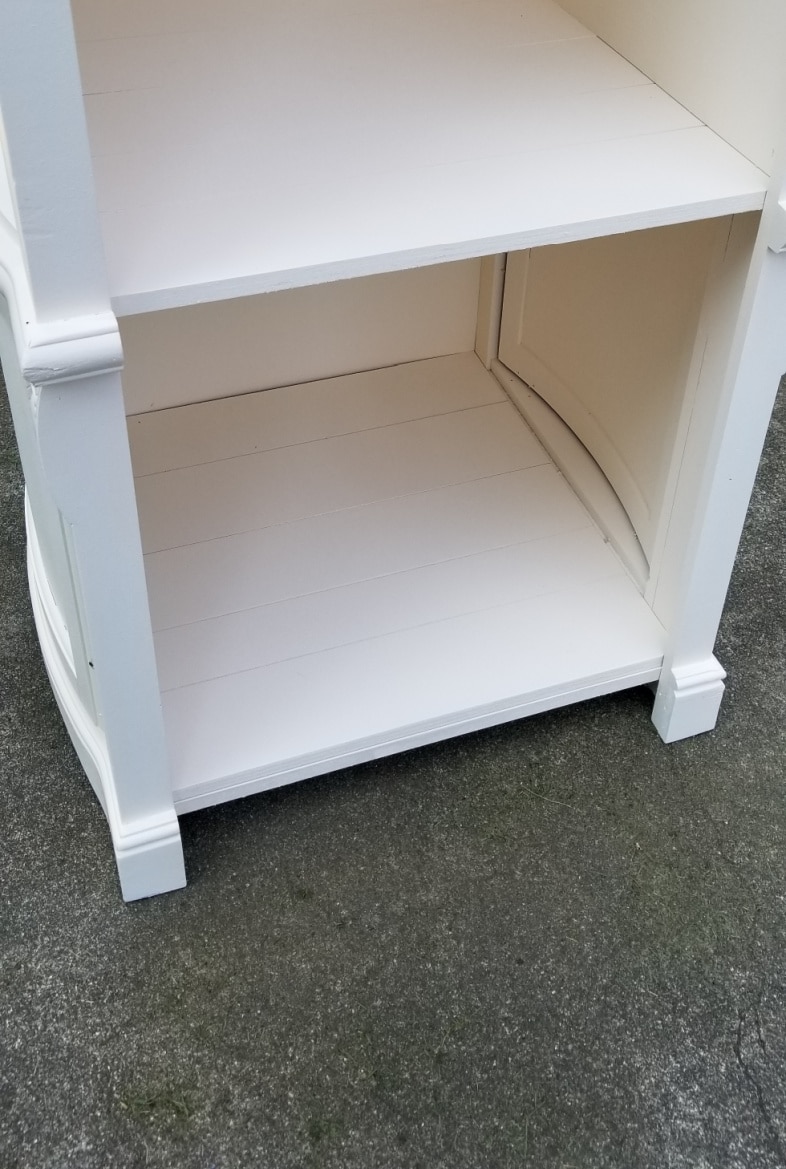 closeup of faux plank shelf painted white