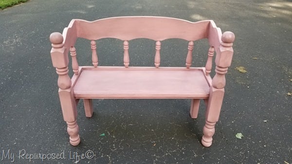 pink and glazed small wooden child bench for toddlers or dolls