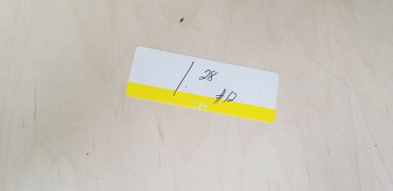 plywood with a price sticker of $1.28