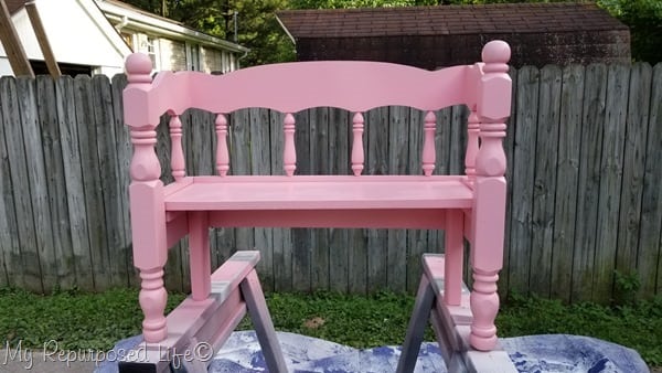 small pink wooden child bench