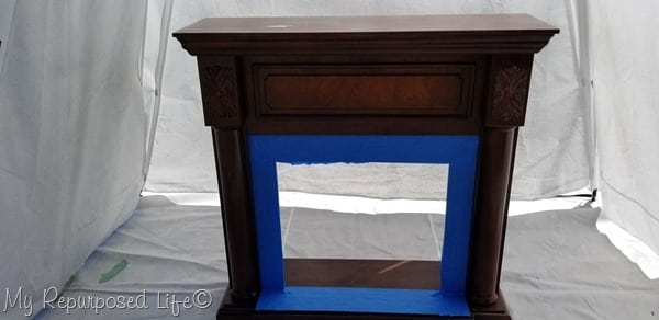 tape off faux fireplace mantel before painting