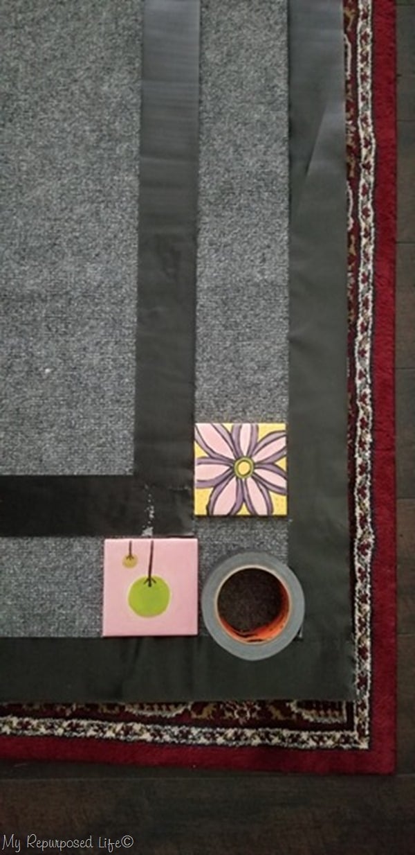 use duct tape to paint a border on outdoor rug
