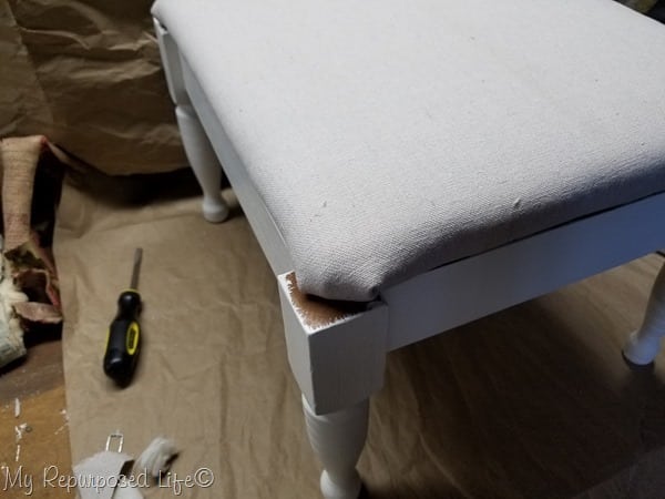 dry fit new upholstered footstool top on base of stool