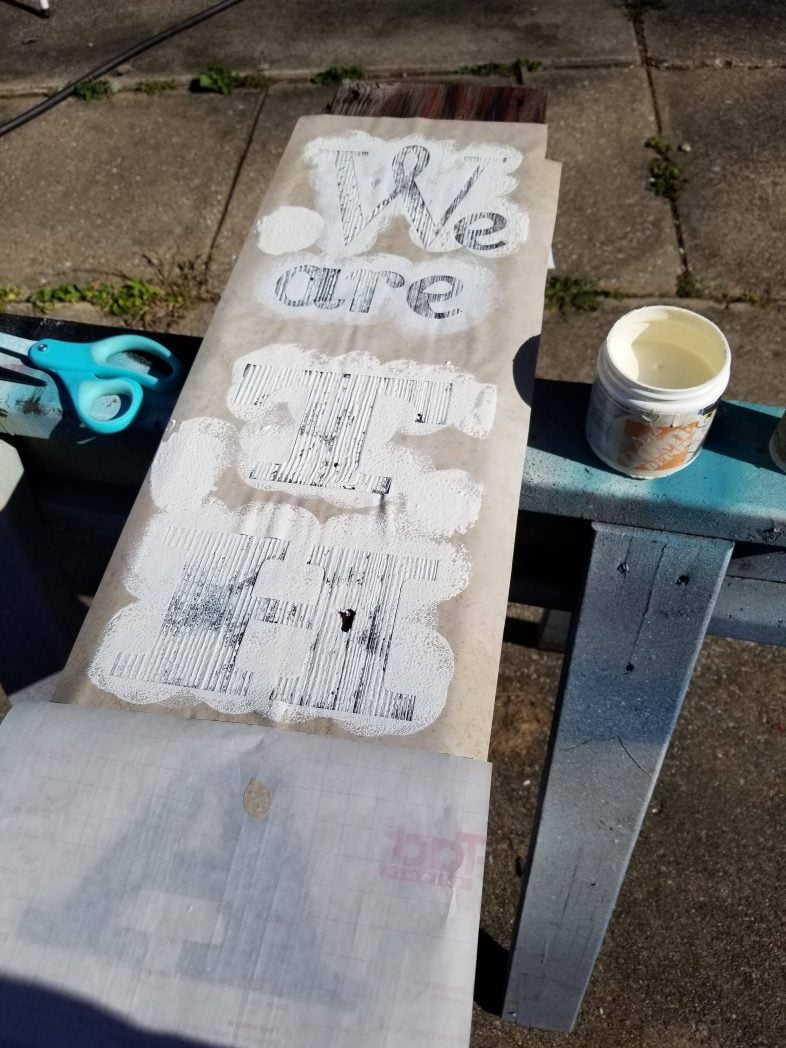 continue to paint the contact paper thankful sign stencil