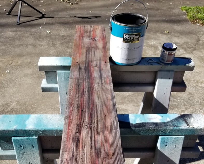 dry brush red board with black paint