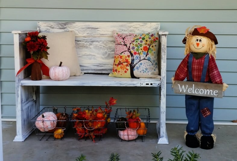 painted crackled dollar store pumpkins with porch decor including a door bench