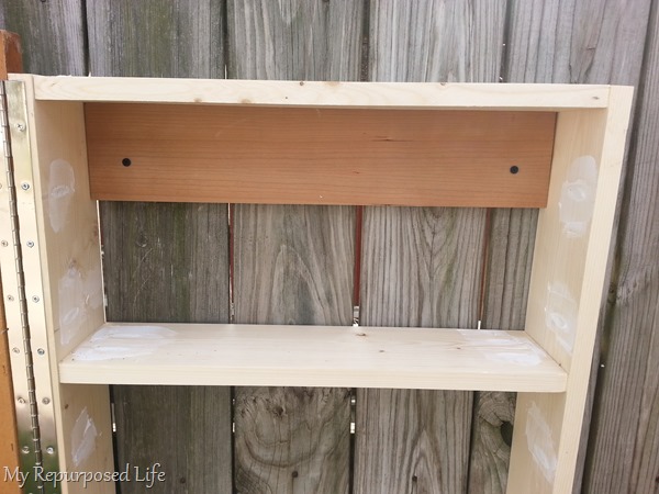 how to secure jewelry cabinet to wall