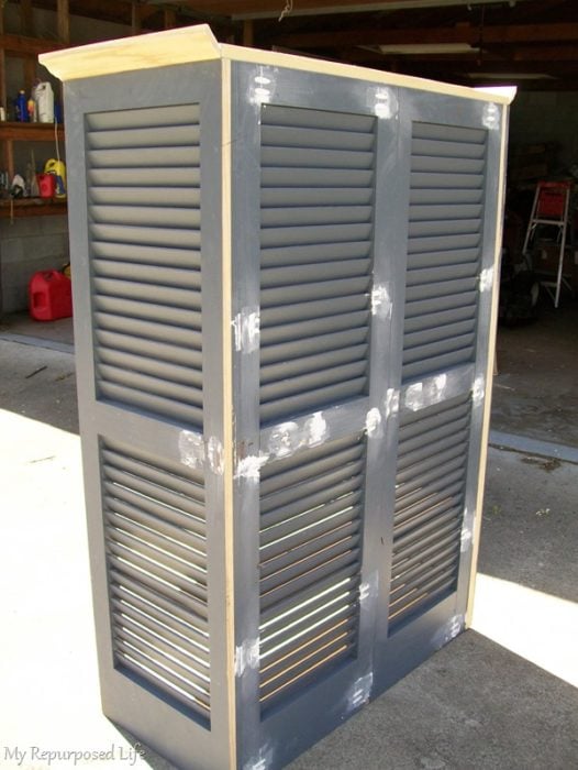 back view of repurposed shutter bookcase