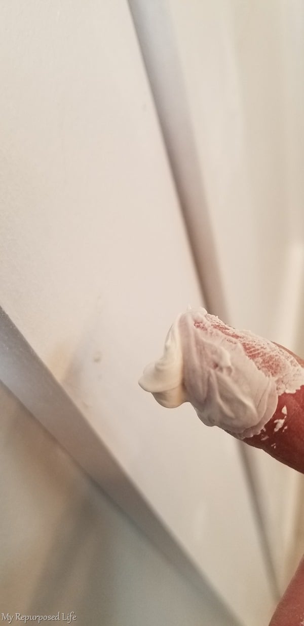 patching nail holes with spackling
