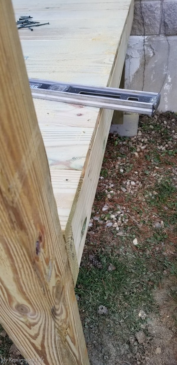 deck boards cut to length with circular saw after installation